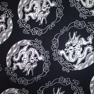 White Dragon Medallions on Black No info available sold by the 1/2 yd.